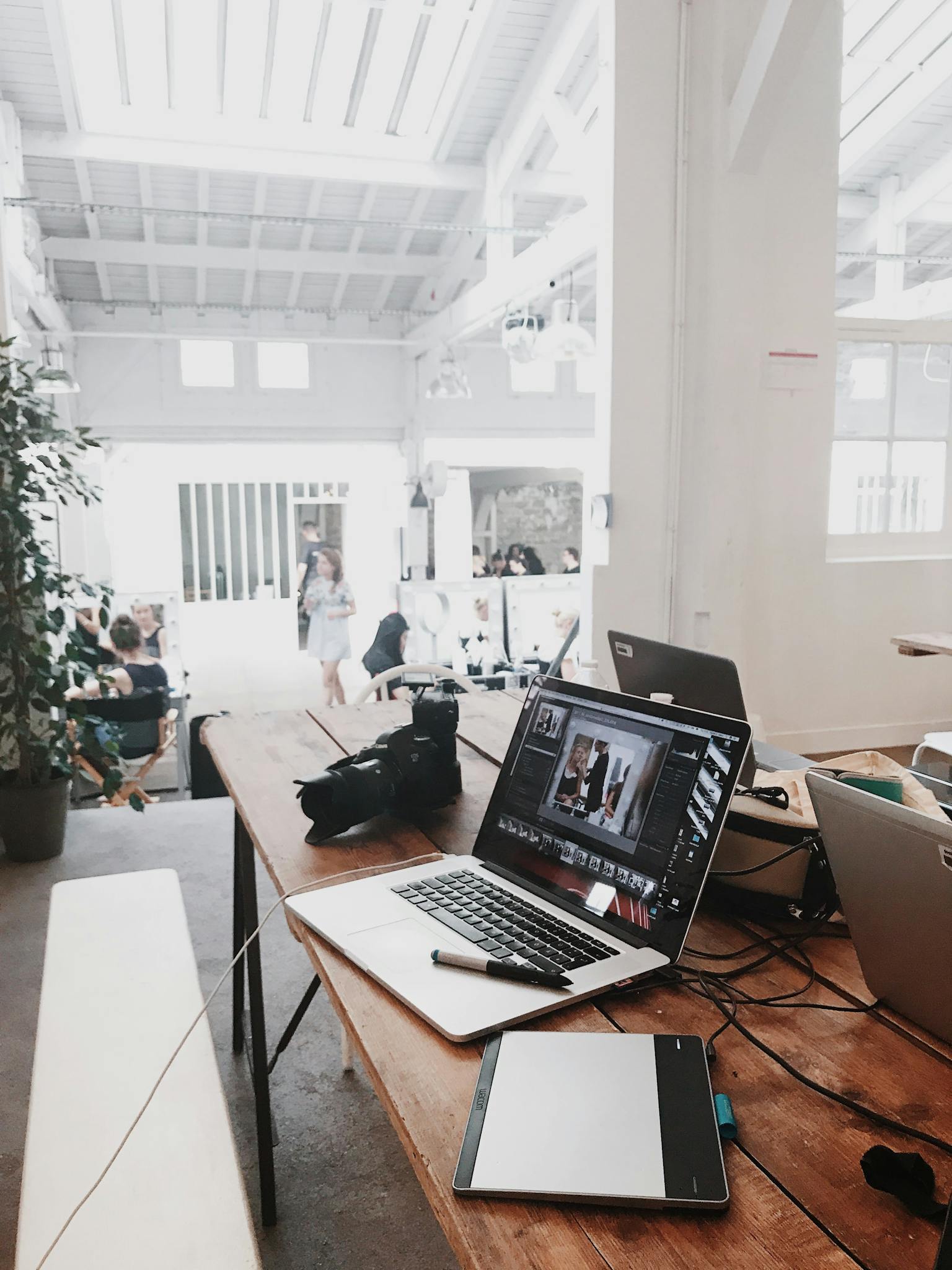 a bright modern workspace featuring laptops a