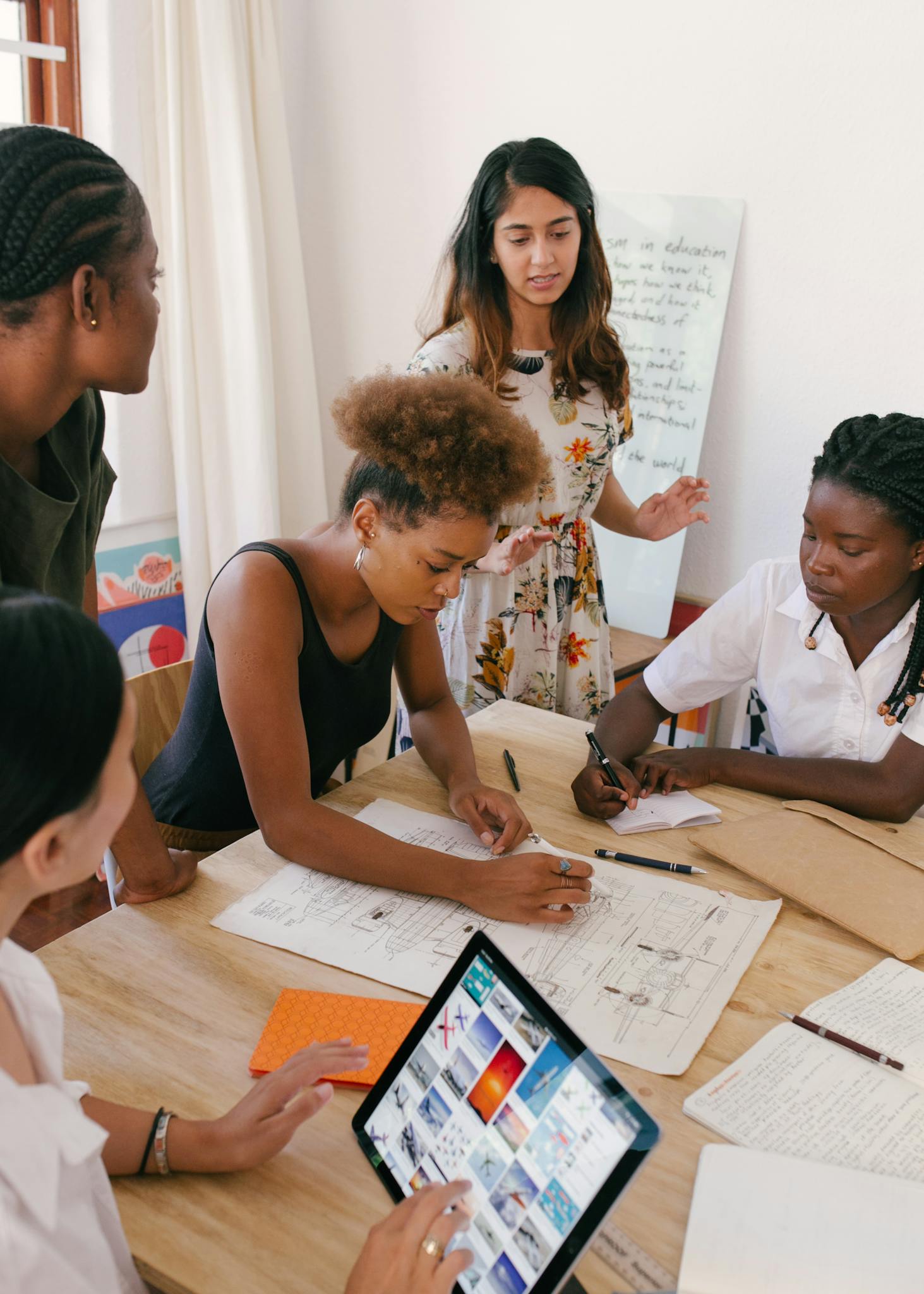 group of women collaborating on a creative