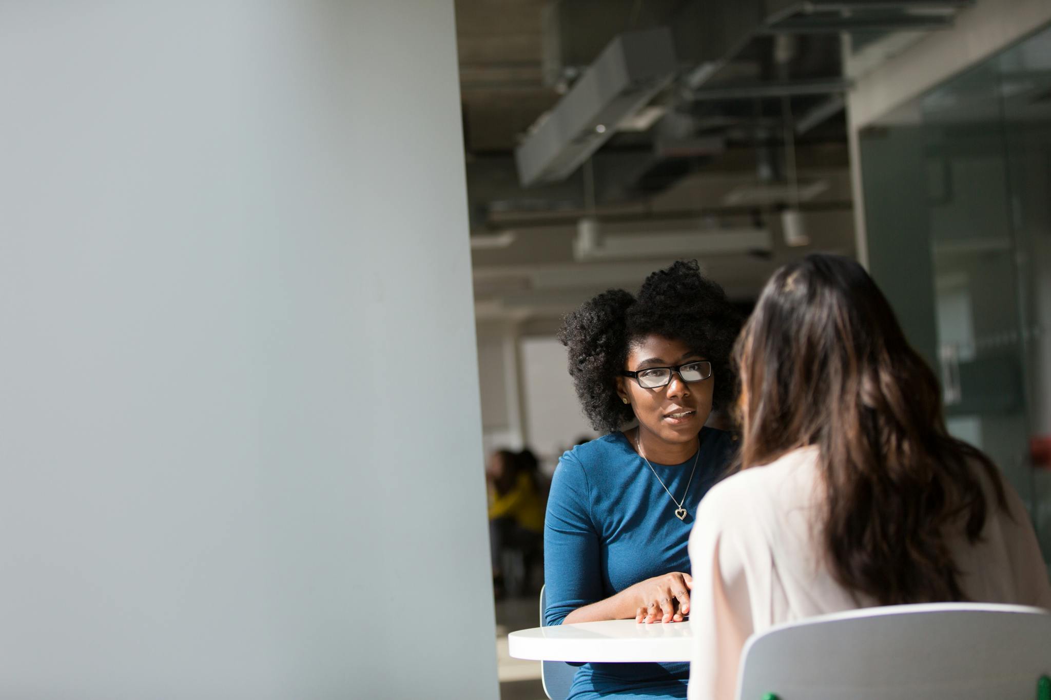 two women engaged in a discussion in